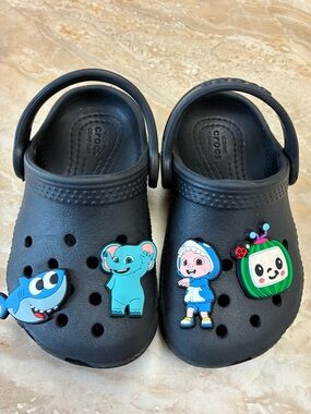 Toddler size 6 CROCS clogs black with Cocomelon charms